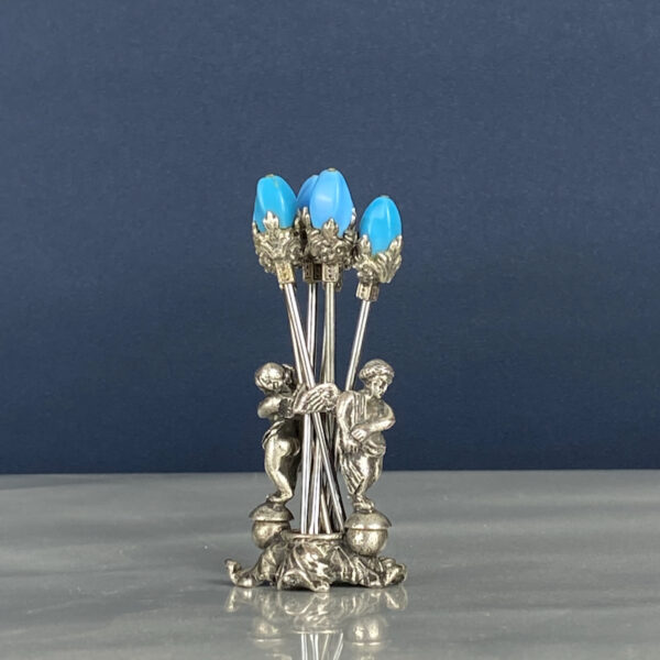 Early 20thc cocktail stick set with cherubs, 1920s cupid martini picks